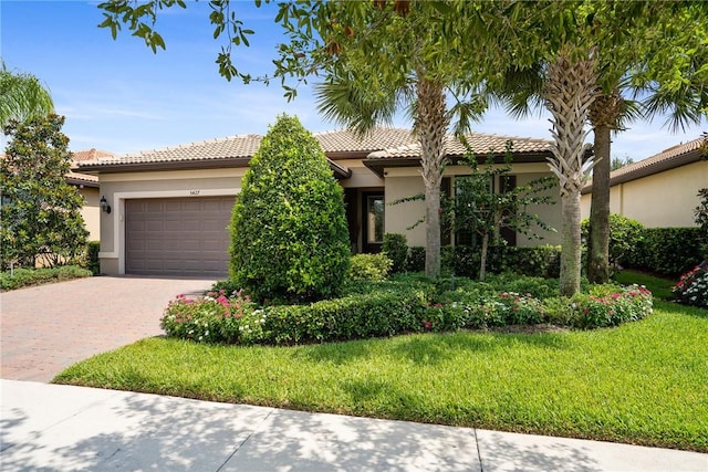 view of front of house with a front lawn and a garage