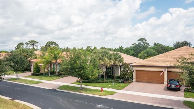 view of front of property with a garage and a front yard