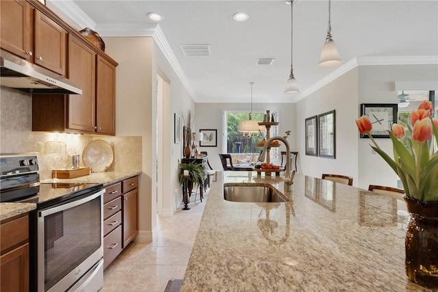 kitchen featuring sink, hanging light fixtures, backsplash, stainless steel range with electric stovetop, and light tile patterned floors