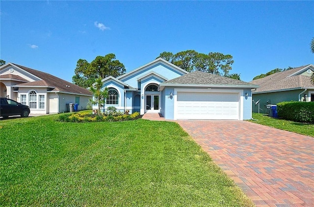 ranch-style house featuring a garage and a front yard