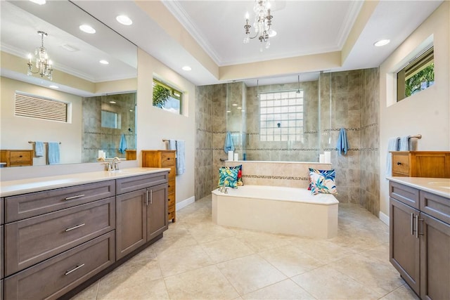 bathroom with an inviting chandelier, vanity, and ornamental molding