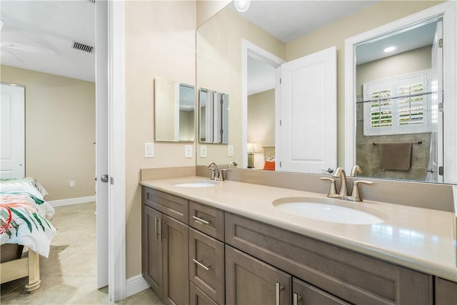 bathroom with vanity and tile patterned flooring