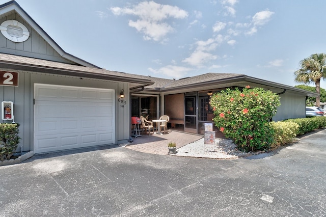 single story home featuring a garage