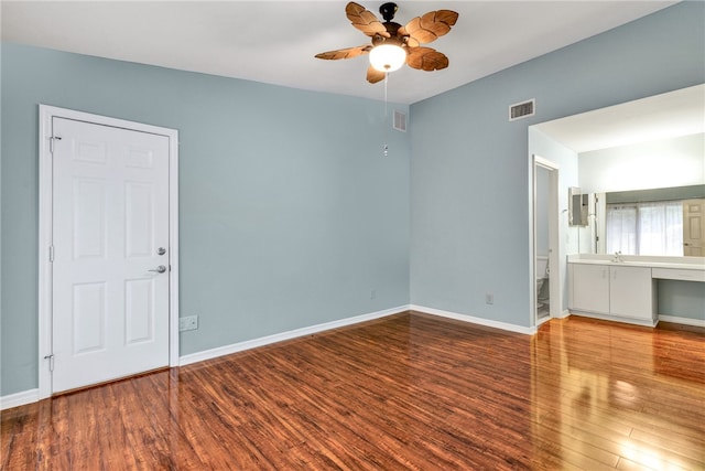 unfurnished room with ceiling fan and wood-type flooring