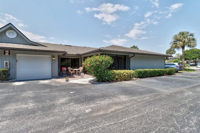 single story home featuring a garage