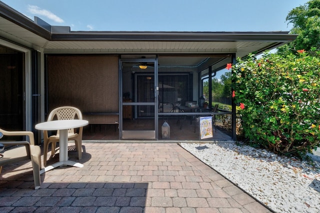 view of patio with a sunroom