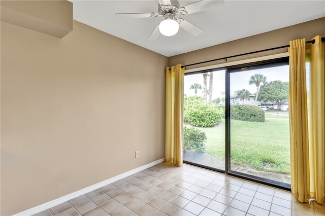 tiled empty room with ceiling fan