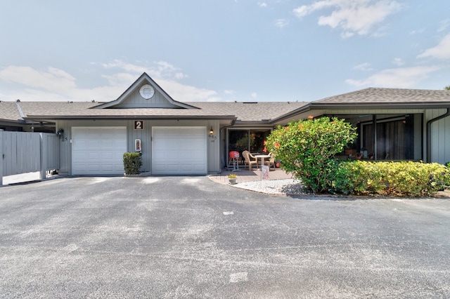 ranch-style home featuring a garage