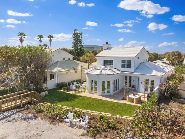 birds eye view of property featuring a water view and a view of the beach