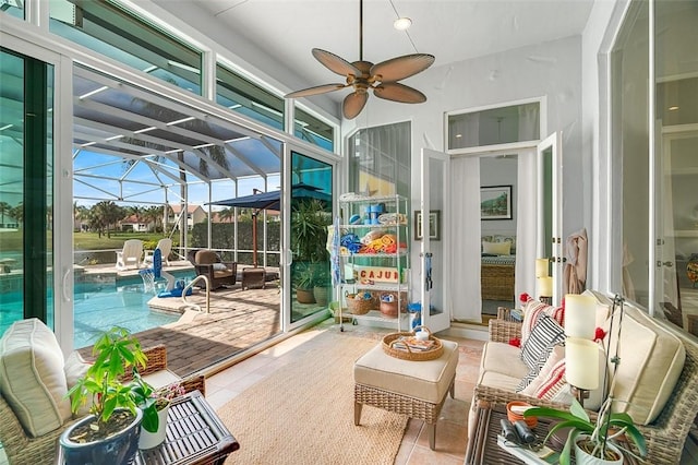 sunroom with a ceiling fan