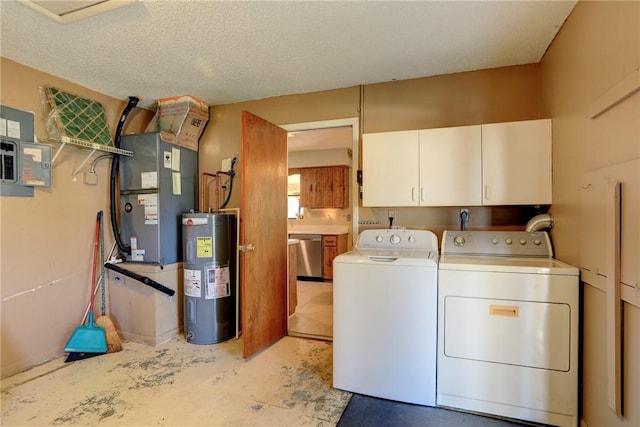 clothes washing area featuring washer and dryer, heating unit, cabinets, electric water heater, and a textured ceiling