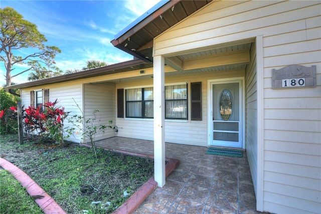 entrance to property featuring a patio area