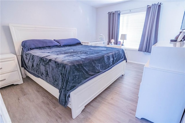 bedroom featuring light wood-type flooring