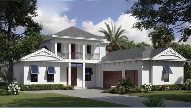 1083 W Polo Grounds Dr, Vero Beach, FL 32966 - view of front of home featuring a balcony, a front yard, stucco siding, and a garage