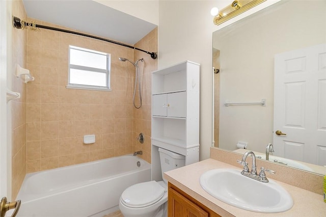 full bathroom with vanity, tiled shower / bath combo, and toilet