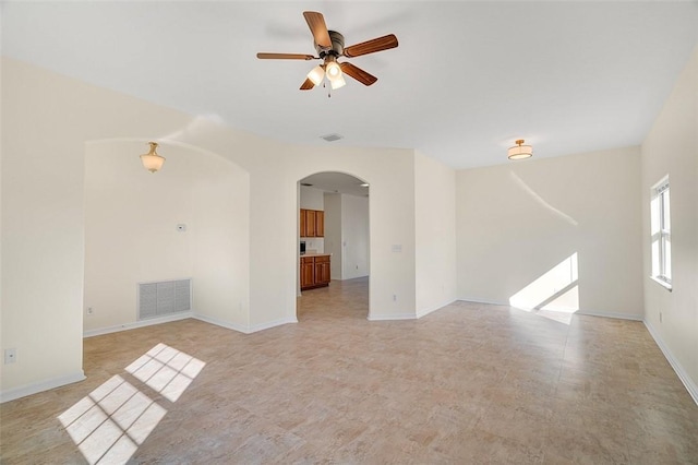 spare room with ceiling fan