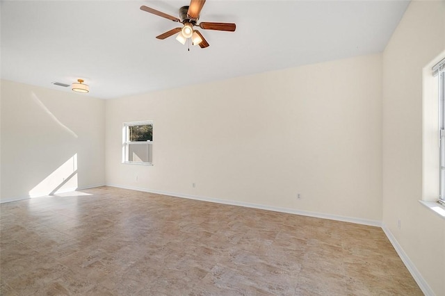 unfurnished room featuring ceiling fan