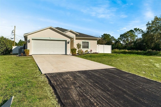 ranch-style home with a garage and a front yard