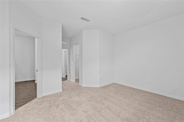 9316 104th Ave, Vero Beach, FL 32967 - carpeted empty room with baseboards
