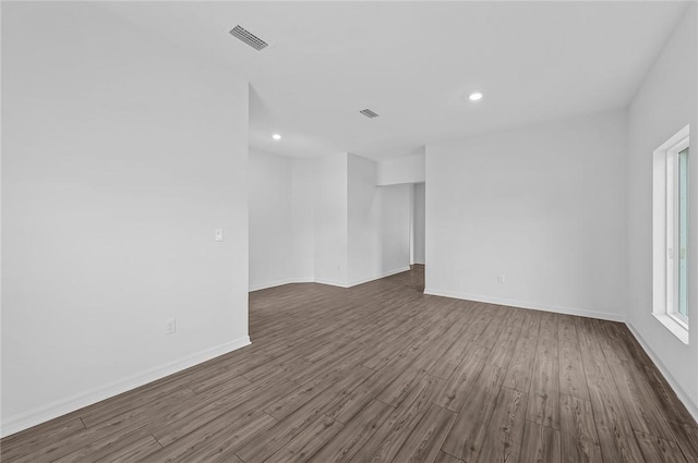 9316 104th Ave, Vero Beach, FL 32967 - unfurnished room featuring dark wood finished floors, baseboards, and recessed lighting