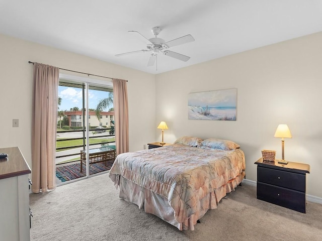 bedroom with access to outside, light colored carpet, and ceiling fan