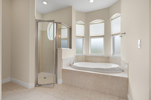 bathroom featuring tile patterned flooring and plus walk in shower