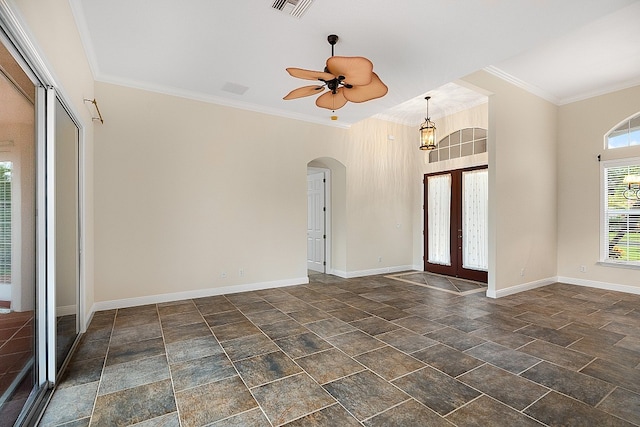 foyer entrance featuring french doors, ceiling fan, and crown molding