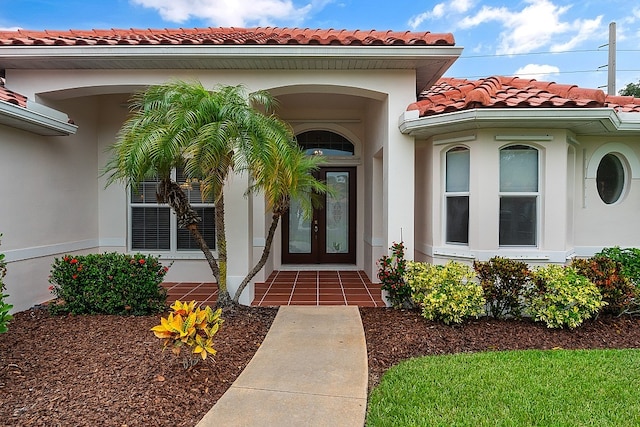 property entrance featuring french doors