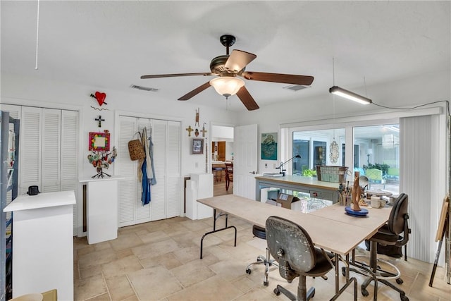 2410 47th Ter, Vero Beach, FL 32966 - dining room with ceiling fan and light stone finish flooring