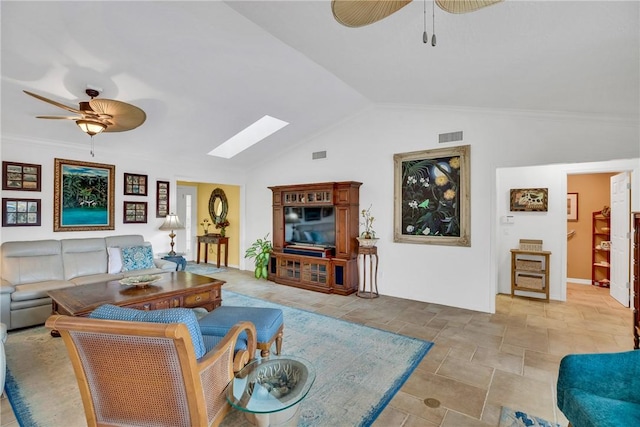 2410 47th Ter, Vero Beach, FL 32966 - living room with ceiling fan, a skylight, light stone finish flooring, and vaulted ceiling