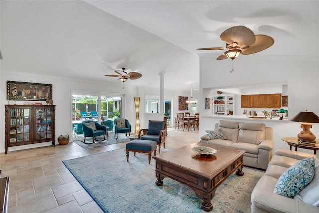 2410 47th Ter, Vero Beach, FL 32966 - living room with ceiling fan, ornamental molding, and lofted ceiling