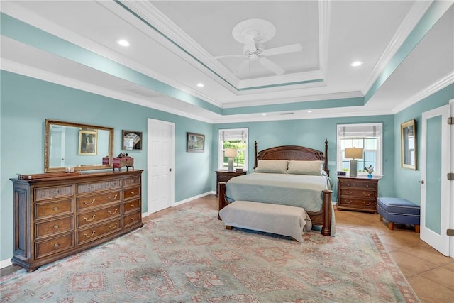 2410 47th Ter, Vero Beach, FL 32966 - bedroom with crown molding, a tray ceiling, a ceiling fan, and recessed lighting