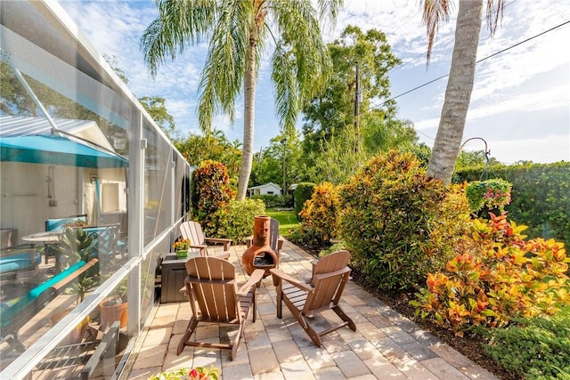 2410 47th Ter, Vero Beach, FL 32966 - view of patio / terrace featuring glass enclosure