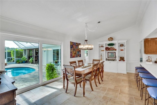 2410 47th Ter, Vero Beach, FL 32966 - dining area featuring stone tile flooring, vaulted ceiling, a chandelier, and crown molding
