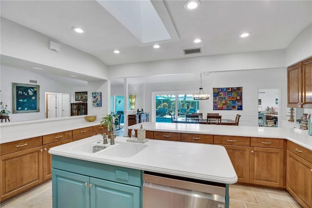 2410 47th Ter, Vero Beach, FL 32966 - kitchen featuring dishwasher, a peninsula, light countertops, a skylight, and recessed lighting