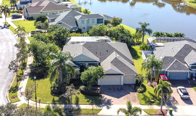 birds eye view of property with a water view