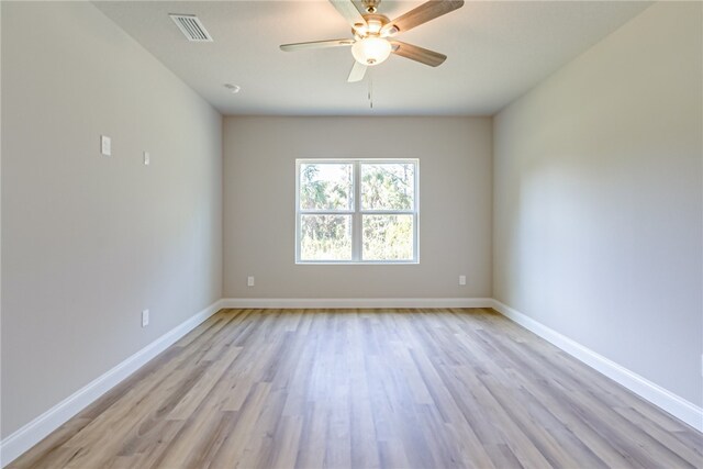 spare room with light hardwood / wood-style floors and ceiling fan