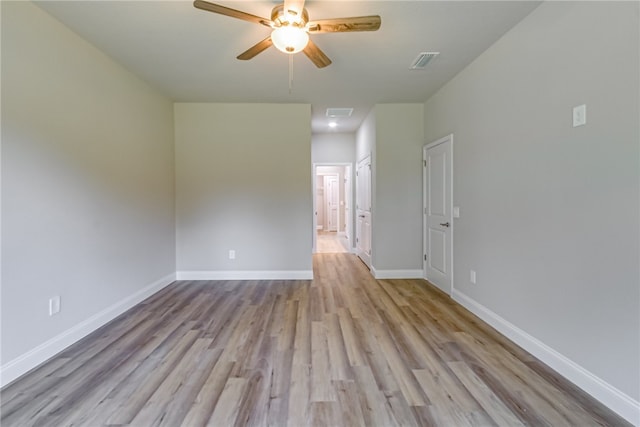 unfurnished room featuring ceiling fan and light hardwood / wood-style flooring