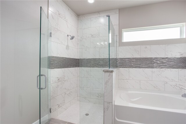 bathroom featuring plus walk in shower