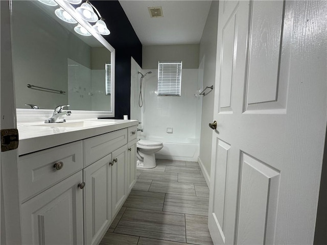 6075 46th Ln, Vero Beach, FL 32967 - full bath with vanity, toilet, shower / washtub combination, and baseboards