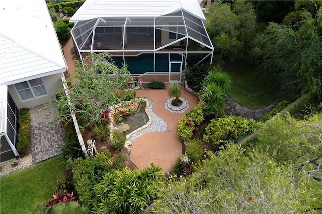 8720 Wakefield Dr, West Palm Beach, FL 33410 - rear view of property featuring a patio area and glass enclosure