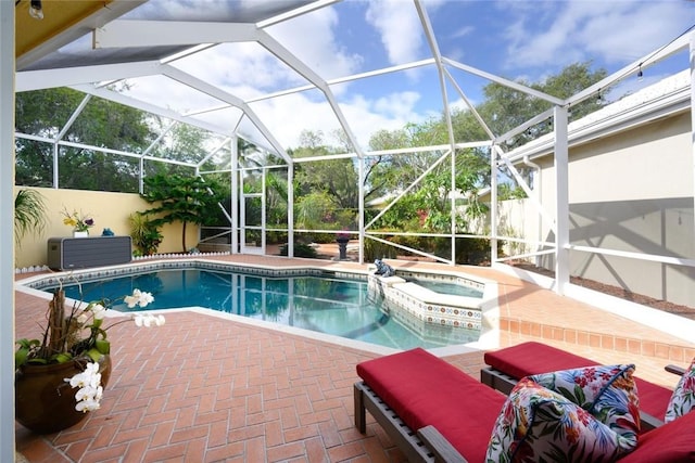 8720 Wakefield Dr, West Palm Beach, FL 33410 - view of pool with glass enclosure, a pool with connected hot tub, and a patio