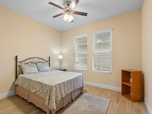 bedroom featuring ceiling fan and light hardwood / wood-style floors