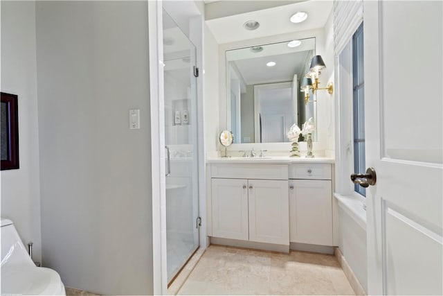 bathroom with vanity, toilet, and a shower with door