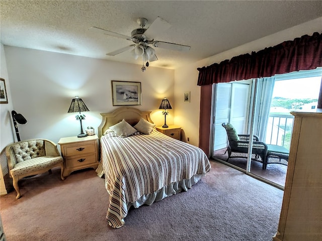 carpeted bedroom featuring a textured ceiling, access to exterior, and ceiling fan