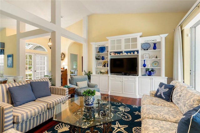 living room featuring hardwood / wood-style floors and vaulted ceiling