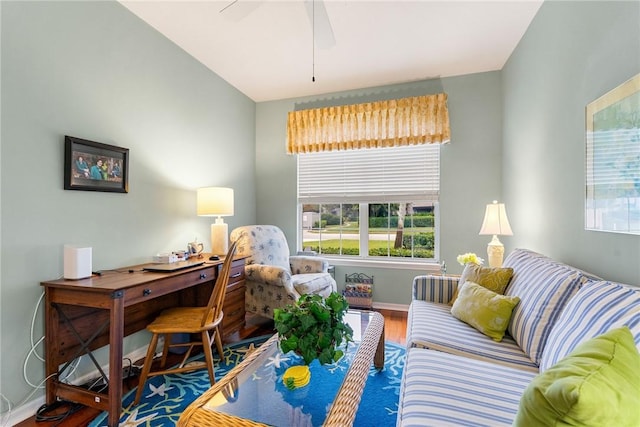 living room with ceiling fan and hardwood / wood-style floors