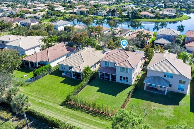 birds eye view of property featuring a residential view and a water view