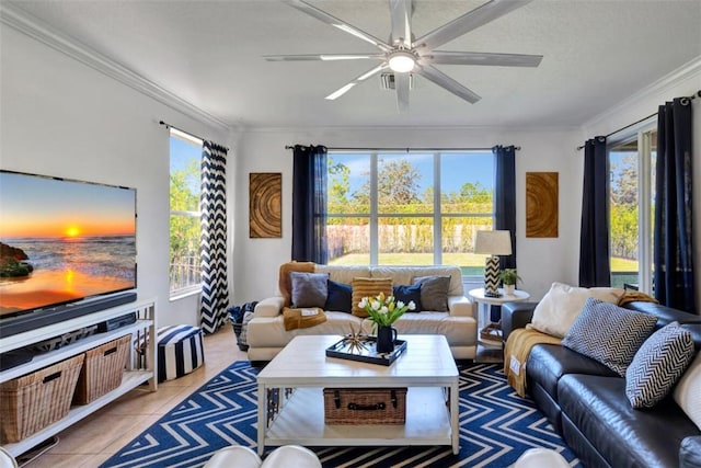 tiled living area with crown molding, a ceiling fan, and a wealth of natural light