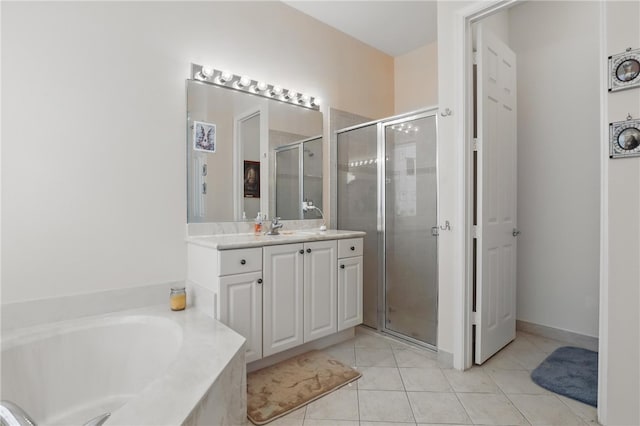 1877 Grey Falcon Cir SW, Vero Beach, FL 32962 - bathroom with vanity, a stall shower, tile patterned flooring, and a bath